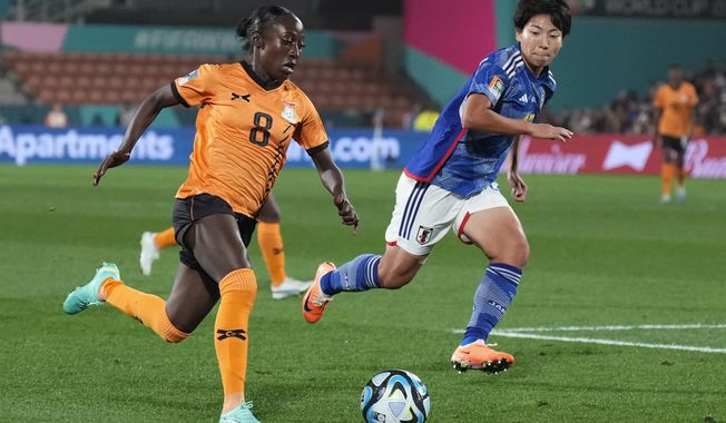 Zambia&#x27;s Margaret Belemu attempts to run past Japan&#x27;s Kiko Seike, right, during the Women&#x27;s World Cup Group C soccer match between Zambia and Japan in Hamilton, New Zealand, Saturday, July 22, 2023. (AP Photo/John Cowpland)