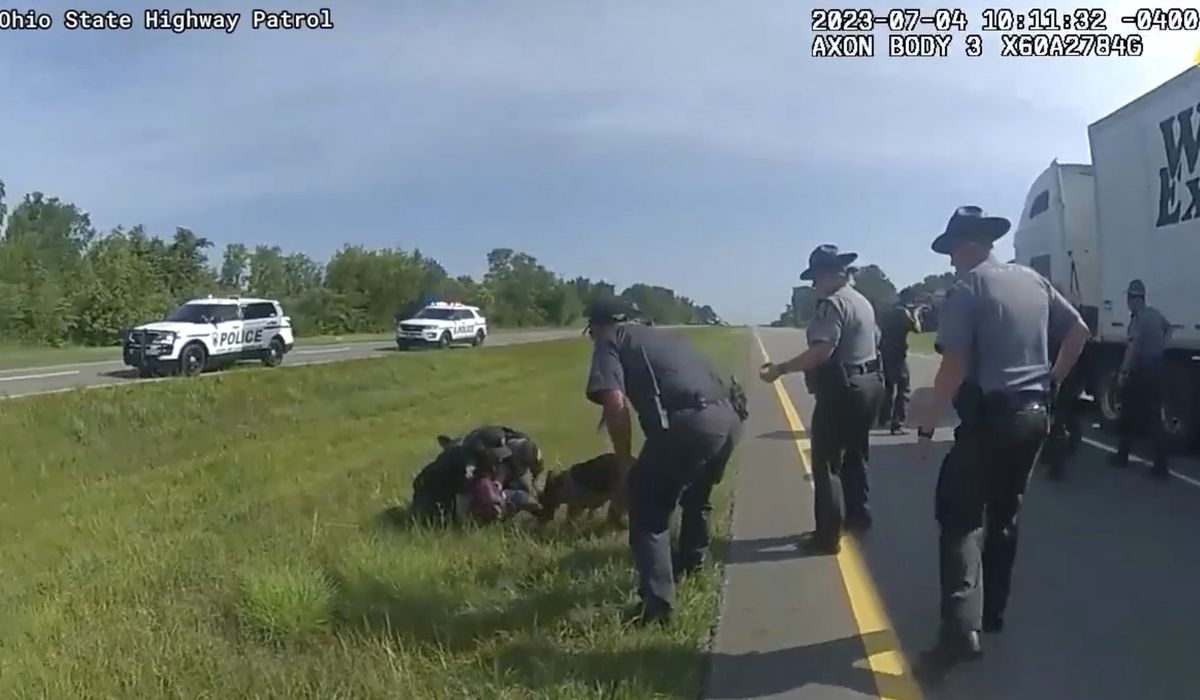 NextImg:Ohio officer put on paid leave amid probe into police dog attack on surrendering truck driver