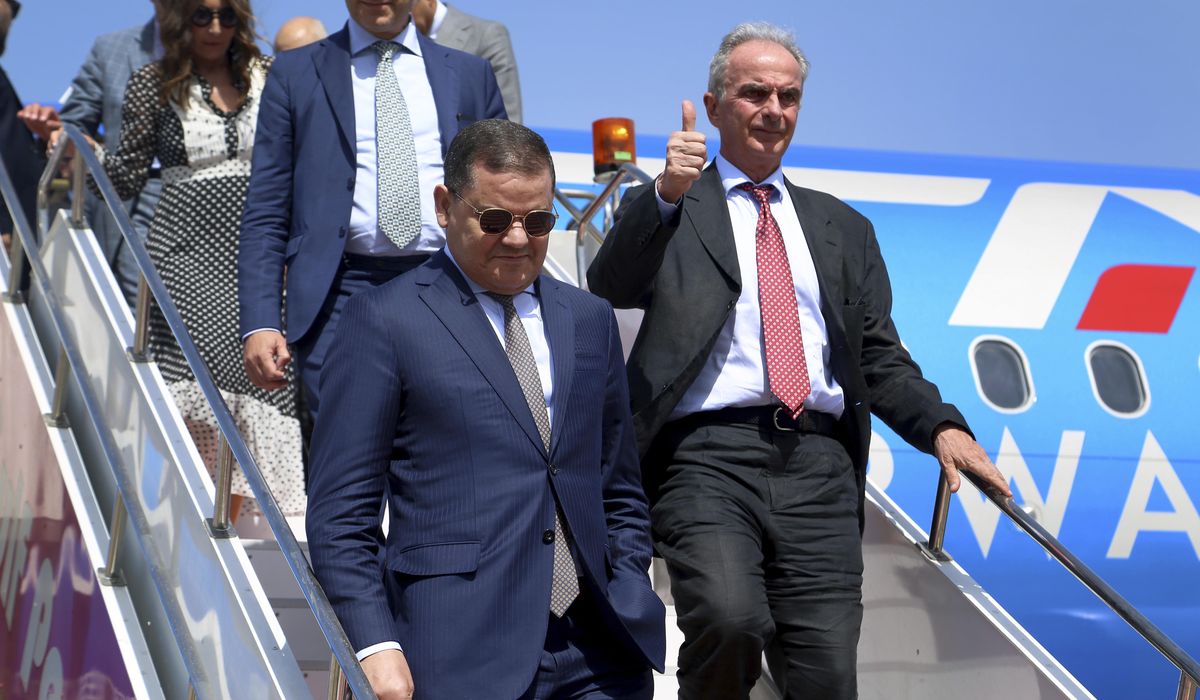 NextImg:One of Libya’s rival prime ministers returns to Tripoli on 1st commercial flight from Italy in years