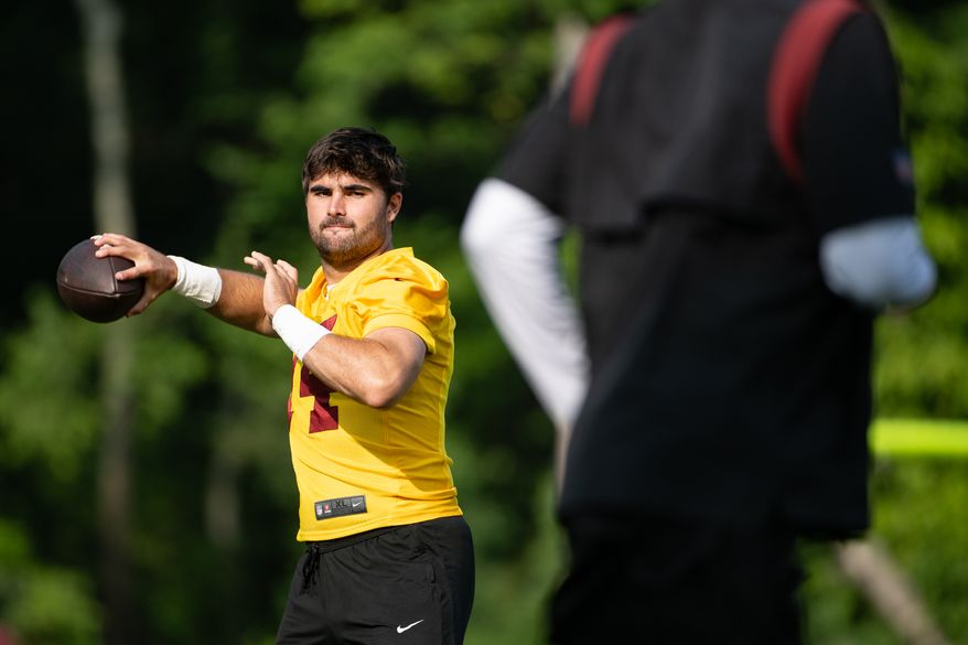 Washington Commanders quarterback Sam Howell (14) throws a pass during the first day of training camp at the OrthoVirginia Training Center at Commanders Park in Ashburn, Virginia, July 27, 2023. (Photo by Brian Murphy)