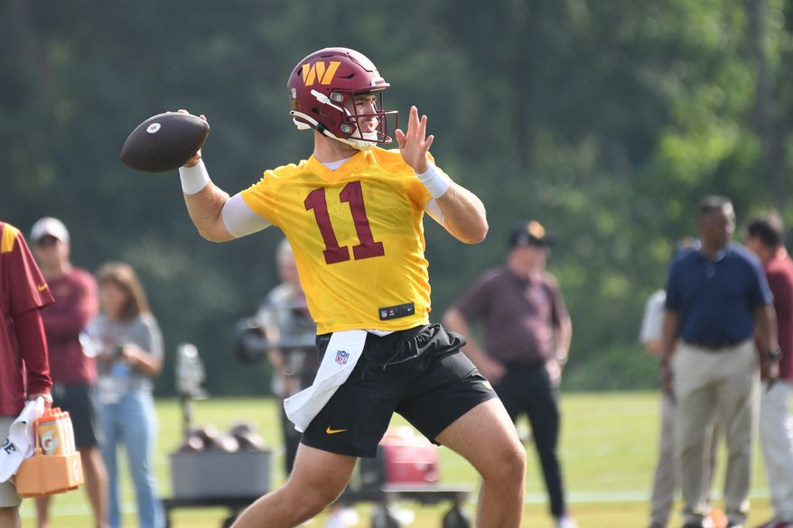 Washington Commanders quarterback Jake Fromm (11) throwing a pass during the second day of training camp at the OrthoVirginia Training Center at Commanders Park in Ashburn, Virginia, July 28, 2023. (Photo by Billy Sabatini)