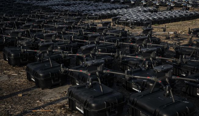About 1700 drones are displayed before being sent to the frontline, to be used against Russian forces in Kyiv, Ukraine, Tuesday, July 25, 2023. (AP Photo/Libkos)
