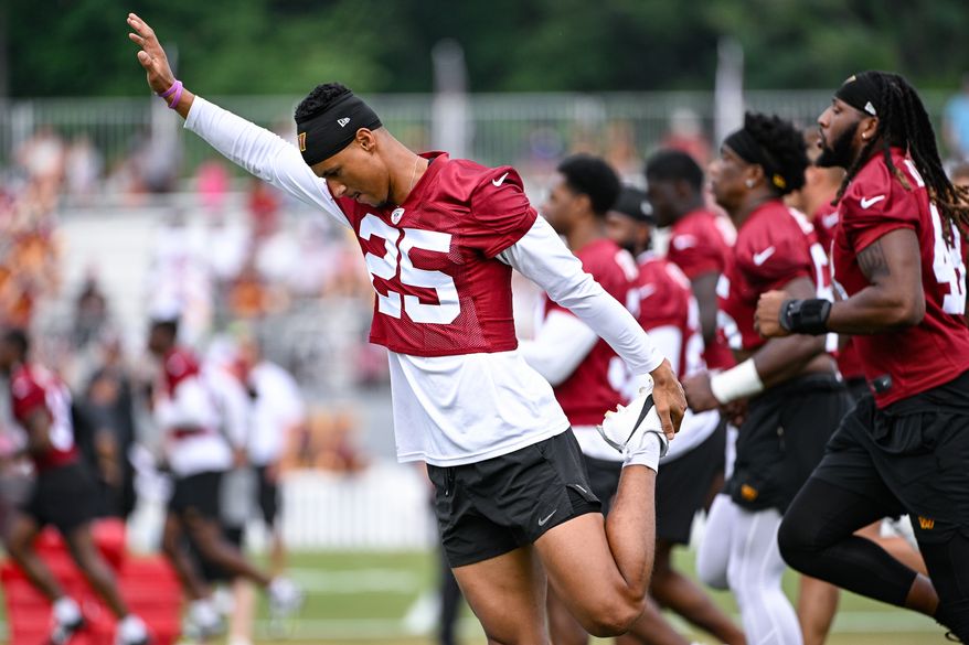 Washington Commanders cornerback Benjamin St-Juste (25) stretches during the second day of training camp at the OrthoVirginia Training Center at Commanders Park in Ashburn, Virginia, July 27, 2023. (Photo by Brian Murphy)