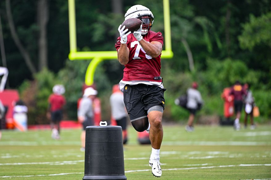 Washington Commanders defensive tackle Benning Potoa’e (79) catches the football during the second day of training camp at the OrthoVirginia Training Center at Commanders Park in Ashburn, Virginia, July 27, 2023. (Photo by Brian Murphy)