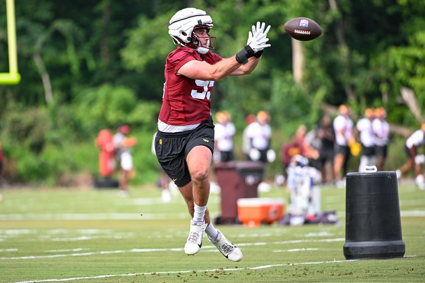 Washington Commanders defensive end Casey Toohill (95) catches the football during the second day of training camp at the OrthoVirginia Training Center at Commanders Park in Ashburn, Virginia, July 27, 2023. (Photo by Brian Murphy)