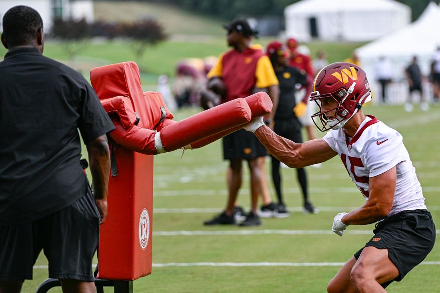 Washington Commanders receiver Dax Milne (15) goes through positional drills during the second day of training camp at the OrthoVirginia Training Center at Commanders Park in Ashburn, Virginia, July 27, 2023. (Photo by Brian Murphy)