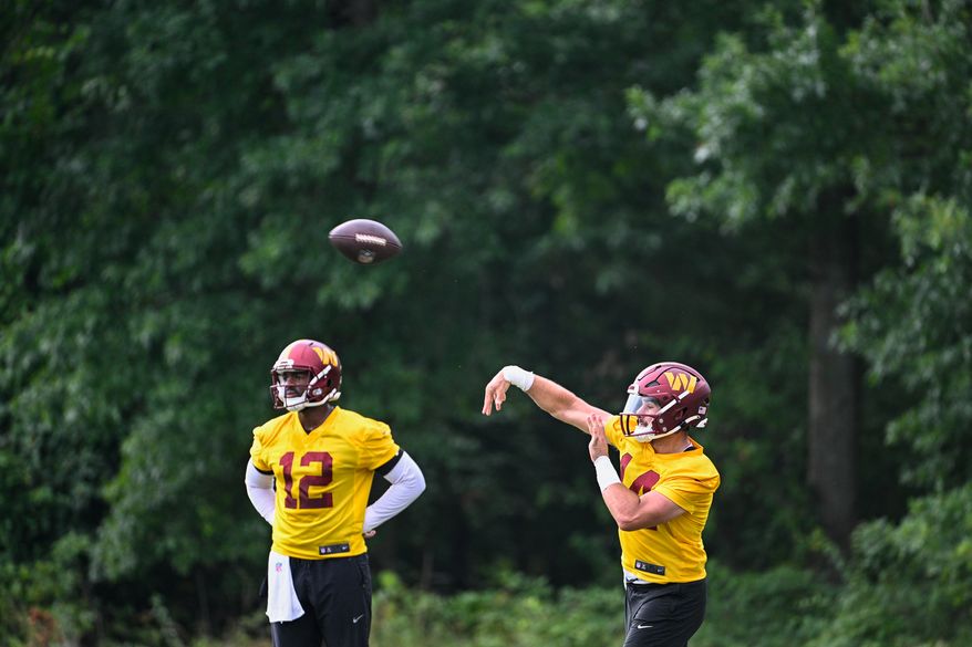 Washington Commanders quarterback Sam Howell (14) throws a pass during the second day of training camp at the OrthoVirginia Training Center at Commanders Park in Ashburn, Virginia, July 27, 2023. (Photo by Brian Murphy)
