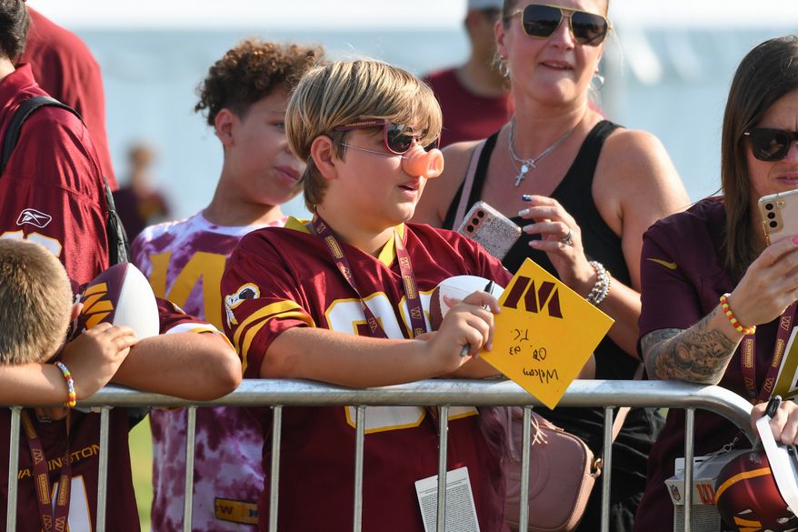 A young fan in the crowd during the third day of training camp at the OrthoVirginia Training Center at Commanders Park in Ashburn, Virginia, July 29, 2023. (Photo by Billy Sabatini)