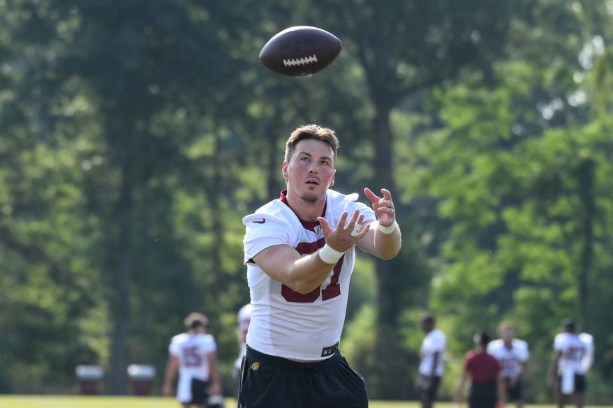 Washington Commanders tight end John Bates (87) reaches for a pass during the third day of training camp at the OrthoVirginia Training Center at Commanders Park in Ashburn, Virginia, July 29, 2023. (Photo by Billy Sabatini)