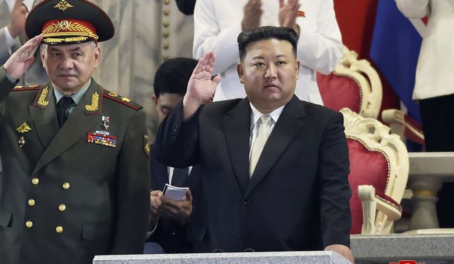 In this photo provided by the North Korean government, North Korean leader Kim Jong-un, right, and Russian Defense Minister Sergei Shoigu attend a military parade to mark the 70th anniversary of the armistice that halted fighting in the 1950-53 Korean War, on Kim Il Sung Square in Pyongyang, North Korea Thursday, July 27, 2023. Independent journalists were not given access to cover the event depicted in this image distributed by the North Korean government. The content of this image is as provided and cannot be independently verified. Korean language watermark on image as provided by source reads: &quot;KCNA&quot; which is the abbreviation for Korean Central News Agency. (Korean Central News Agency/Korea News Service via AP) **FILE**