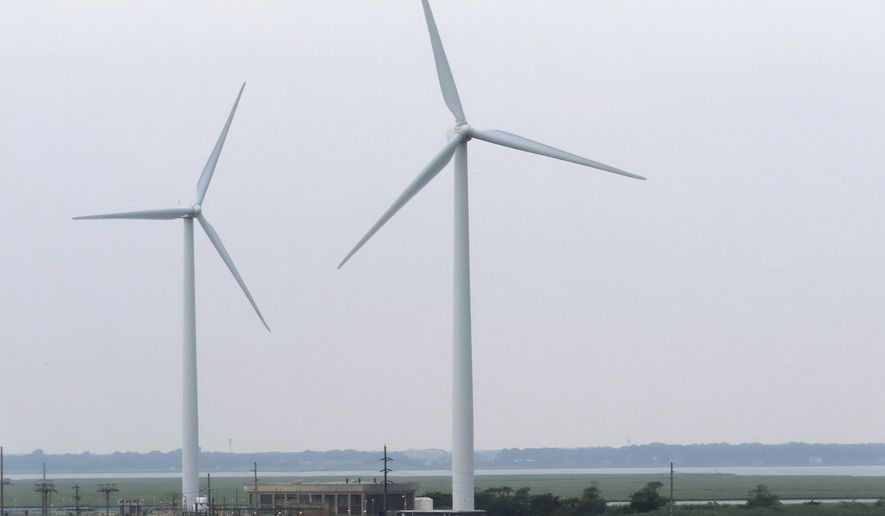 Land-based windmills in Atlantic City turn on Thursday, July 20, 2023. On Thursday, July 27, two groups opposed to offshore wind projects sued New Jersey and the Danish offshore wind energy developer Orsted seeking to overturn the tax break. (AP Photo/Wayne Parry)