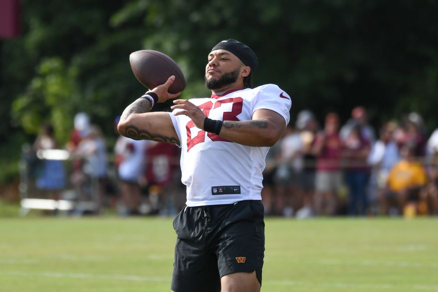 Washington Commanders running back Chris Rodriguez Jr. (23) throwing the ball during the fourth day of training camp at the OrthoVirginia Training Center at Commanders Park in Ashburn, Virginia, July 29, 2023. (Photo by Billy Sabatini)