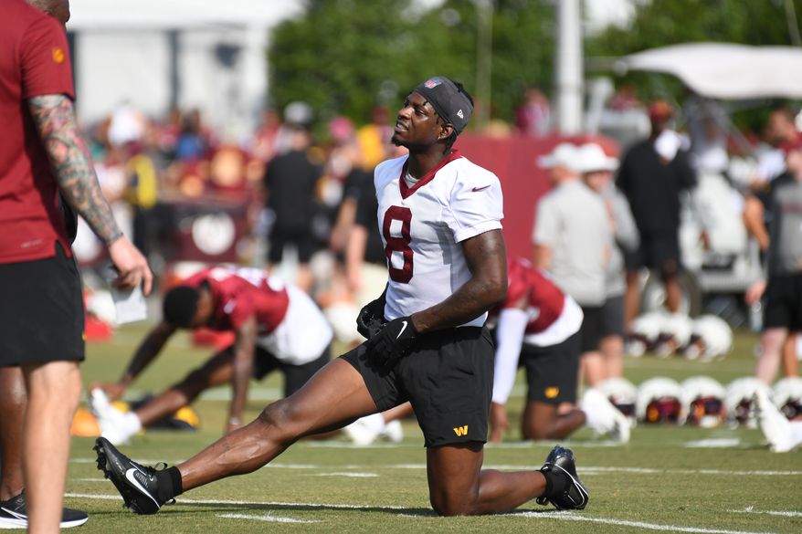 Washington Commanders running back Brian Robinson Jr. (8) on the field during stretching exercises during the fourth day of training camp at the OrthoVirginia Training Center at Commanders Park in Ashburn, Virginia, July 29, 2023. (Photo by Billy Sabatini)