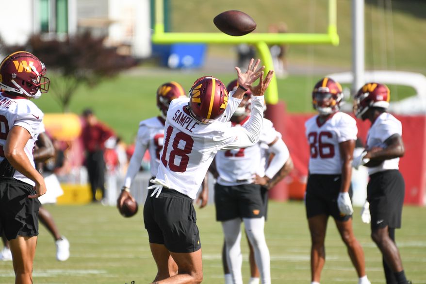 Washington Commanders wide receiver Jalen Sample (18) making a catch during the fourth day of training camp at the OrthoVirginia Training Center at Commanders Park in Ashburn, Virginia, July 29, 2023. (Photo by Billy Sabatini)