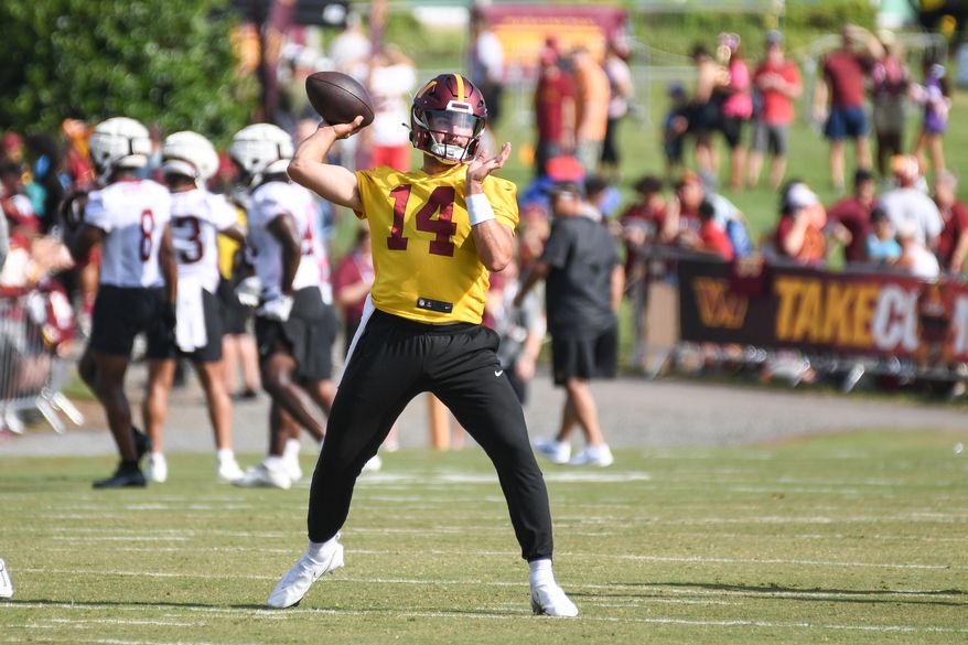 Washington Commanders quarterback Sam Howell (14) throwing a pass during the fourth day of training camp at the OrthoVirginia Training Center at Commanders Park in Ashburn, Virginia, July 29, 2023. (Photo by Billy Sabatini)