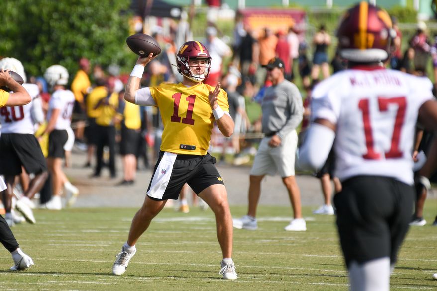 Washington Commanders quarterback Jake Fromm (11) throwing the ball during the fourth day of training camp at the OrthoVirginia Training Center at Commanders Park in Ashburn, Virginia, July 29, 2023. (Photo by Billy Sabatini)