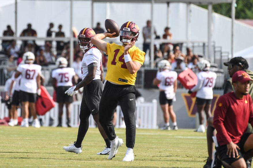 Washington Commanders quarterback Sam Howell (14) throwing a pass during the fourth day of training camp at the OrthoVirginia Training Center at Commanders Park in Ashburn, Virginia, July 29, 2023. (Photo by Billy Sabatini)