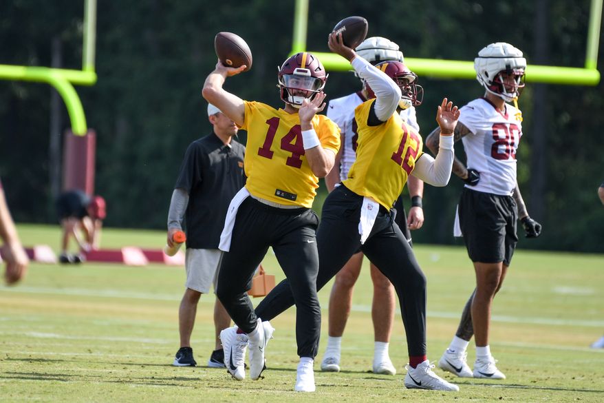 Washington Commanders quarterback Sam Howell (14) throwing a pass during the fourth day of training camp at the OrthoVirginia Training Center at Commanders Park in Ashburn, Virginia, July 29, 2023. (Photo by Billy Sabatini)