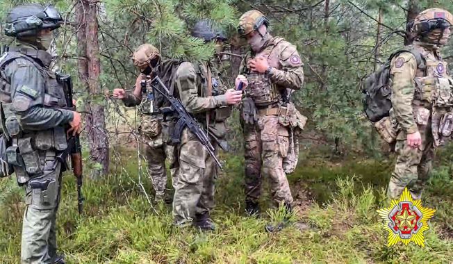 In this grab taken from video released by Belarus&#x27; Defense Ministry on Thursday, July 20, 2023, Belarusian soldiers of the Special Operations Forces (SOF) and mercenary fighters from Wagner private military company attend the weeklong maneuvers conducted at a firing range near the border city of Brest, Belarus. The Polish prime minister says that more than 100 mercenaries belonging to the Russian-linked Wagner group in Belarus have moved close to the border with Poland. (Belarus&#x27; Defense Ministry via AP, File)