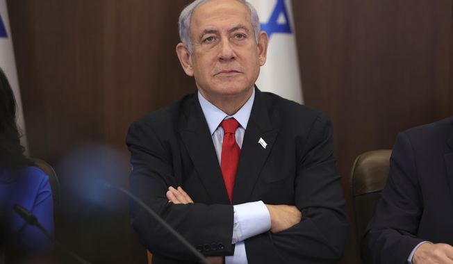 Israeli Prime Minister Benjamin Netanyahu attends the weekly cabinet meeting at the prime minister&#x27;s office in Jerusalem, Israel, Sunday, July 30, 2023. (Abir Sultan/Pool Photo via AP)