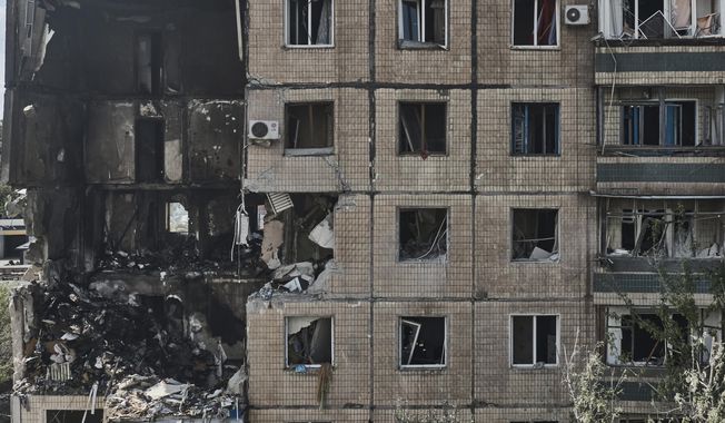 An apartment building after it was hit during a Russian missile strike in Kryvyi Rih, Ukraine, Monday, July 31, 2023. (AP Photo/Libkos)