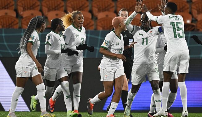 Zambia&#x27;s Barbra Banda, second right, is congratulated by teammate Agness Musase after scoring her team&#x27;s second goal from a penalty during the Women&#x27;s World Cup Group C soccer match between Costa Rica and Zambia in Hamilton, New Zealand, Monday, July 31, 2023. (AP Photo/Andrew Cornaga)