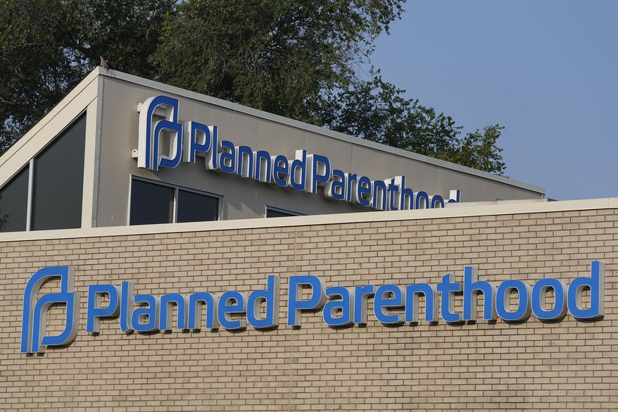A Planned Parenthood sign is displayed on the outside of a clinic during a news conference, Tuesday, Aug. 1, 2023, in Indianapolis. (AP Photo/Darron Cummings)