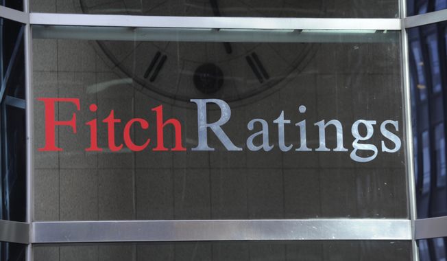 This photo shows signage for Fitch Ratings, Sunday, Oct. 9, 2011, in New York. On Tuesday, Aug. 1, 2023, Fitch Ratings has downgraded the U.S. credit rating, citing an expected increase in government debt over the next three years and a “steady deterioration in standards of governance” over the past two decades. (AP Photo/Henny Ray Abrams, File)