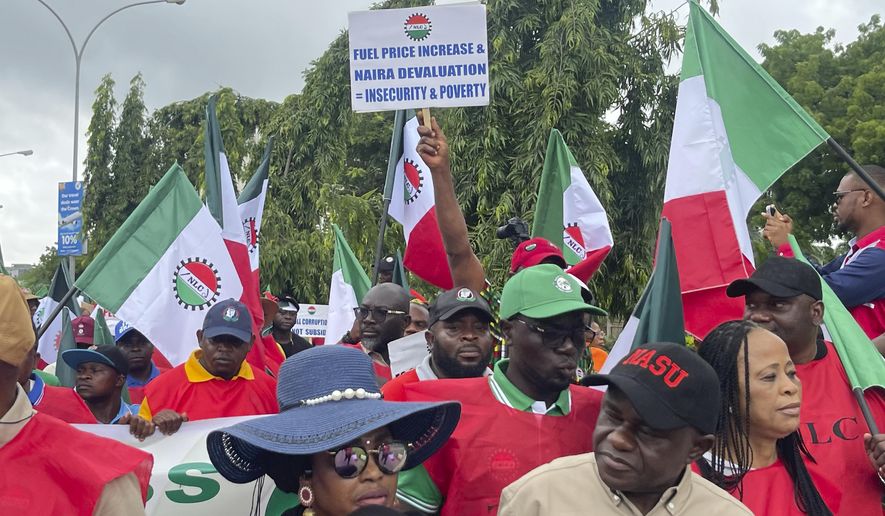 Labour unionists march in the streets of Abuja, Nigeria, Wednesday, Aug. 2, 2023, to protest the soaring cost of living under the West African nation's new president, with calls for the government to improve social welfare interventions to reduce hardship.(AP Photo/ Chinedu Asadu)