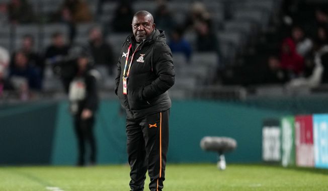 Zambia&#x27;s head coach Bruce Mwape stands by the touchline during the Women&#x27;s World Cup Group C soccer match between Spain and Zambia at Eden Park in Auckland, New Zealand, Wednesday, July 26, 2023. (AP Photo/Abbie Parr)