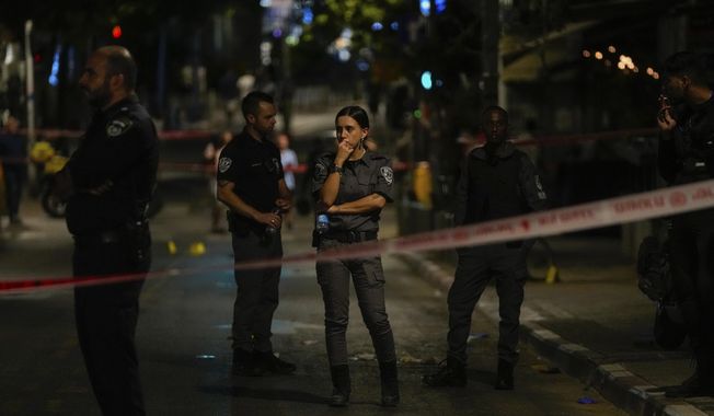 Israeli police inspect the site of a shooting attack in Tel Aviv, Israel, Saturday, Aug 5, 2023. Israeli authorities say a Palestinian gunman opened fire in central Tel Aviv, critically wounding one person before he was shot dead by police. (AP Photo/Maya Alleruzzo)