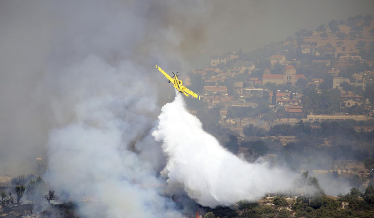 NextImg:Multinational force fights stubborn wildfire in Cyprus, including Lebanon, Greece and Jordan