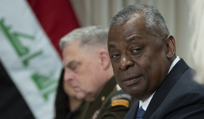 Secretary of Defense Lloyd Austin, second from right, with Chairman of the Joint Chiefs of Staff Gen. Mark Milley speaks during a meeting with Iraq&#x27;s Minister of Defense Thabit Muhammad Al-Abbas at the Pentagon in Washington, Monday, Aug. 7, 2023. (AP Photo/Manuel Balce Ceneta)