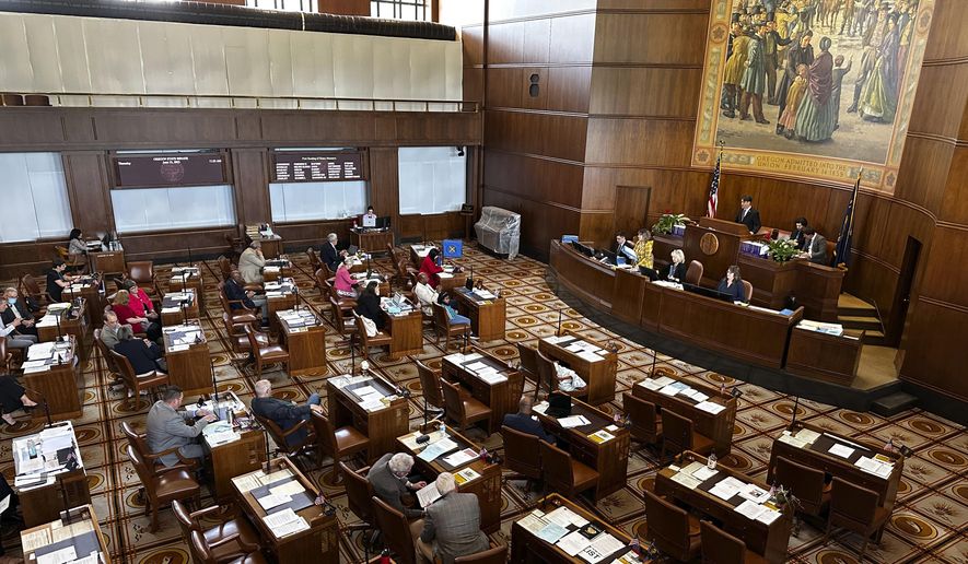 The Oregon Senate is seen in session at the state capitol in Salem, Ore., Thursday, June 15, 2023. Oregon's elections chief says the 10 Republican state senators who had more than 10 unexcused absences during the most recent GOP walkout can't run for reelection in 2024. Secretary of State LaVonne Griffin-Valade made the announcement Tuesday, Aug. 8, 2023, in a bid to clear up confusion over reelection rules following the 2023 walkout. (AP Photo/Andrew Selsky, File)