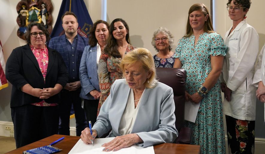 Maine Gov. Janet Mills signs into law a bill expanding access to abortions later in pregnancy, July 19, 2023, at the State House in Augusta, Maine. Groups opposed to Maine's new law expanding abortion access won't attempt to nullify the statute through a so-called People's Veto referendum. Republican Rep. Laurel Libby, leader of the Speak Up for LIFE group, said, Wednesday, Aug. 9, that allies decided that the costs of collecting signatures and running a campaign represented too big of a hurdle. Instead, the groups intend to focus on electing candidates who are opposed to abortions. (AP Photo/Robert F. Bukaty, File)