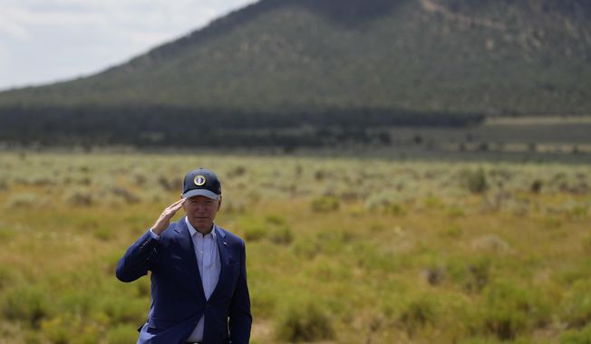 President Joe Biden moties after speaking where he signed a proclamation designating the Baaj Nwaavjo I&#x27;Tah Kukveni National Monument at the Red Butte Airfield Tuesday, Aug. 8, 2023, in Tusayan, Ariz.