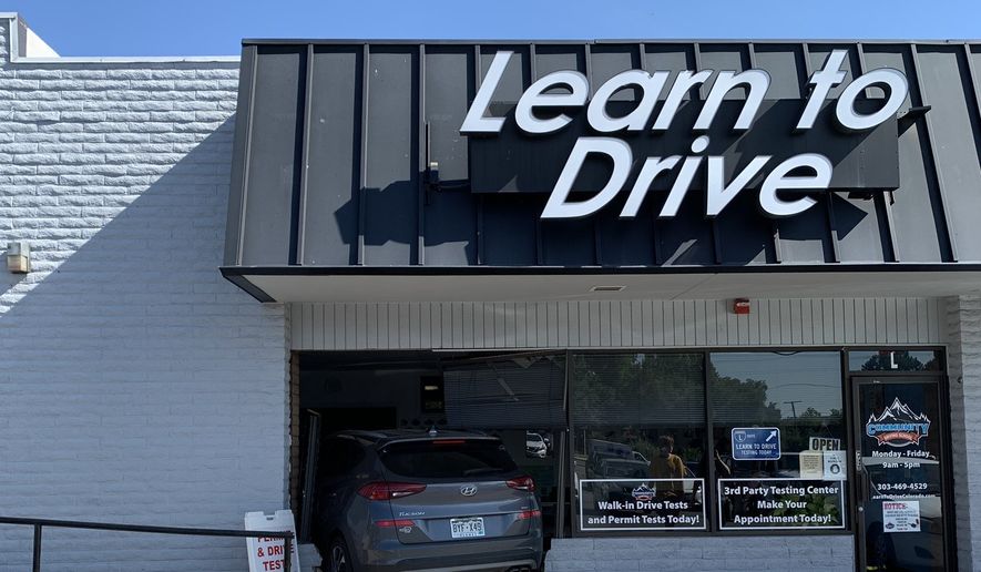 The Lakewood Police Department released this image of a gray Hyundai Tucson sticking out of a broken storefront. Police posted the image on X, the platform formerly known as Twitter. (Image: @LakewoodPDCO)