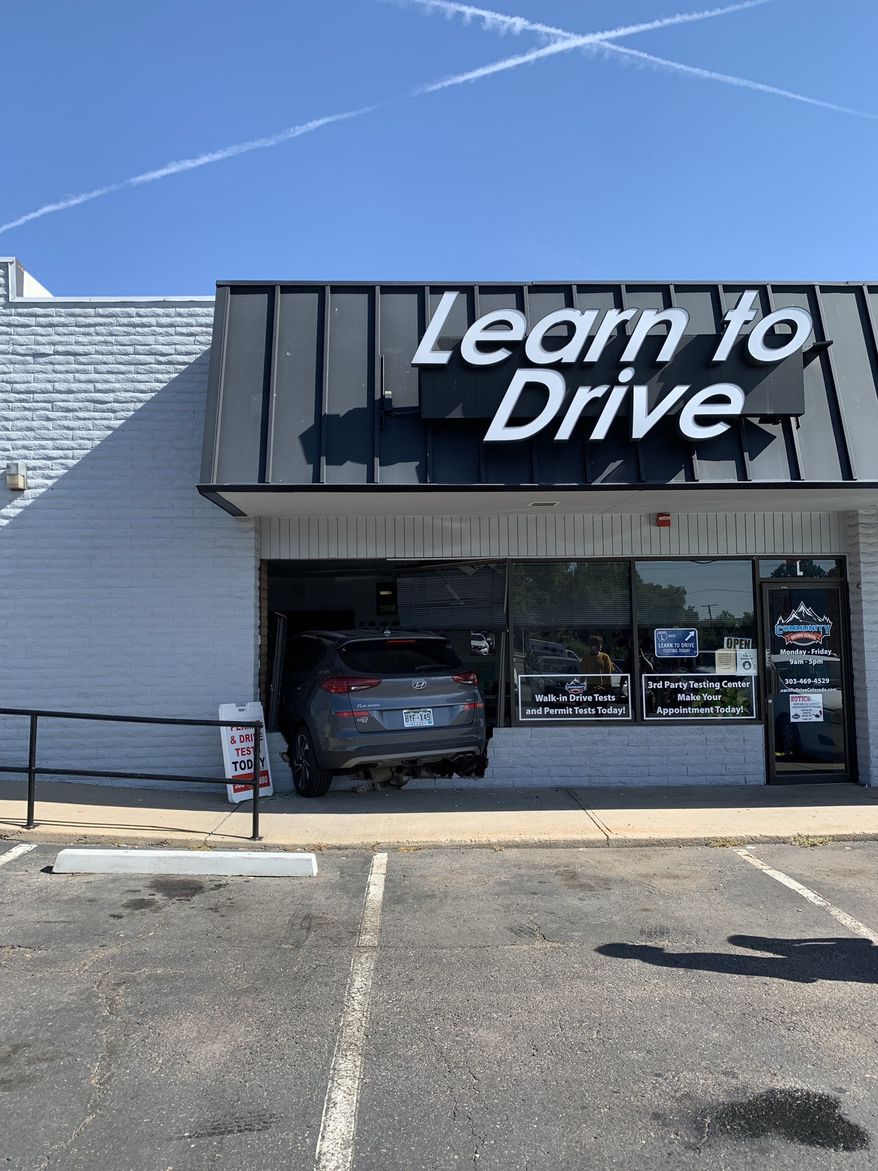 The Lakewood Police Department released this image of a gray Hyundai Tucson sticking out of a broken storefront. Police posted the image on X, the platform formerly known as Twitter. (Image: @LakewoodPDCO)
