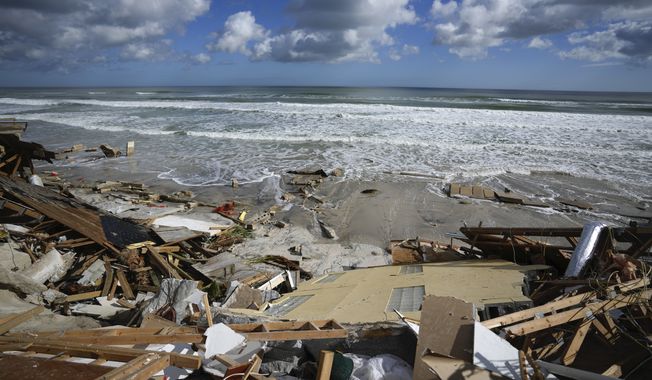 A piece of wall is seen amid the wreckage of Nina Lavigna&#x27;s beachfront home, after half of her house collapsed following Hurricane Nicole, Nov. 12, 2022, in Wilbur-By-The-Sea, Fla. Record hot ocean temperatures and a tardy El Nino are doubling the chances of a nasty Atlantic hurricane season this summer and fall, the National Oceanic and Atmospheric Administration said Thursday, Aug. 10, 2023. (AP Photo/Rebecca Blackwell, File)