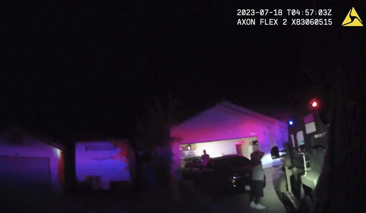 NextImg:Police videos show SWAT officers detaining man, woman during home raid in Tupac Shakur cold case