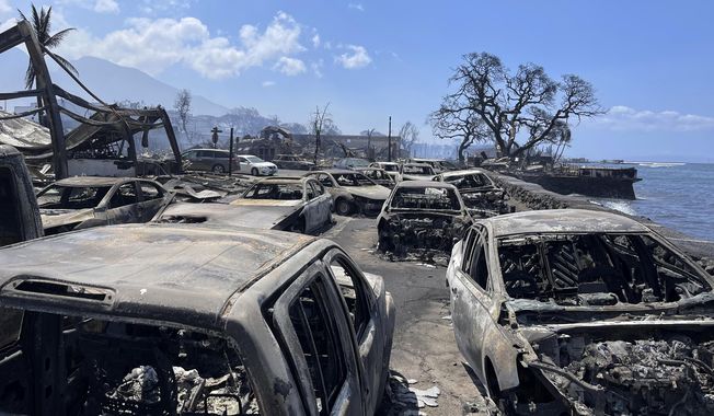 In this photo provided by Tiffany Kidder Winn, burned-out cars sit after a wildfire raged through Lahaina, Hawaii, on Wednesday, Aug. 9, 2023. The scene at one of Maui&#x27;s tourist hubs on Thursday looked like a wasteland, with homes and entire blocks reduced to ashes as firefighters as firefighters battled the deadliest blaze in the U.S. in recent years. (Tiffany Kidder Winn via AP)