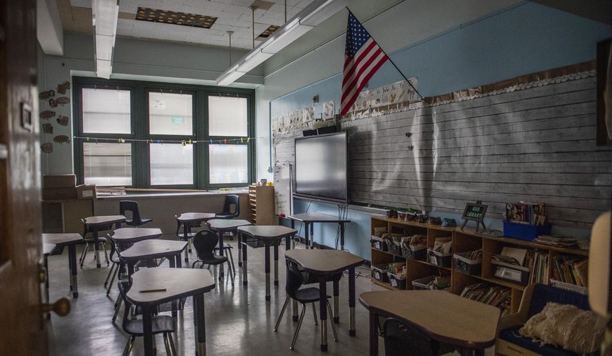 An empty elementary school classroom is seen on Tuesday, Aug. 17, 2021 in the Bronx borough of New York. (AP Photo/Brittainy Newman) **FILE**