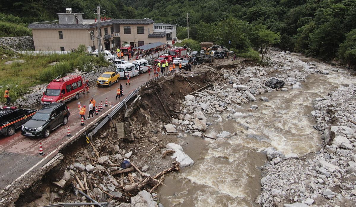NextImg:China evacuates residents and searches for mudslide victims as storms lash parts of the country
