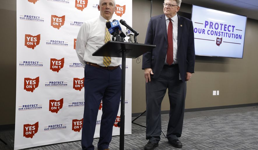 Republican Ohio Senate president Matt Huffman, left, talks to reporters as Republican Ohio state representative Jim Hoops listens in Columbus, Ohio, following the failure of Issue 1 in a special election Tuesday, Aug. 8, 2023. Ohio voters have resoundingly rejected a Republican-backed measure that would have made it more difficult to pass abortion protections. (AP Photo/Paul Vernon)