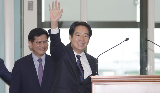 Taiwanese Vice President William Lai waves to the media as he departs for Paraguay at Taoyuan International Airport in Taoyuan, Taiwan, Saturday, Aug. 12, 2023. (AP Photo/Chiang Ying-ying)