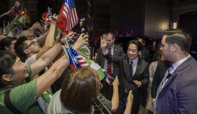 In this photo released by the Taiwan Presidential Office, Taiwan&#x27;s Vice President William Lai, second right, waves as he is greeted by his supporters upon arrival in New York on earlier Sunday, Aug. 13, 2023. Lai left Taiwan Saturday on a trip to Paraguay to reinforce relations with his government&#x27;s last diplomatic partner in South America at a time when China is stepping up efforts to isolate the self-ruled island democracy. Lai&#x27;s trip includes stops in San Francisco and New York City, which Beijing criticized Washington for allowing. (Taiwan Presidential Office via AP)