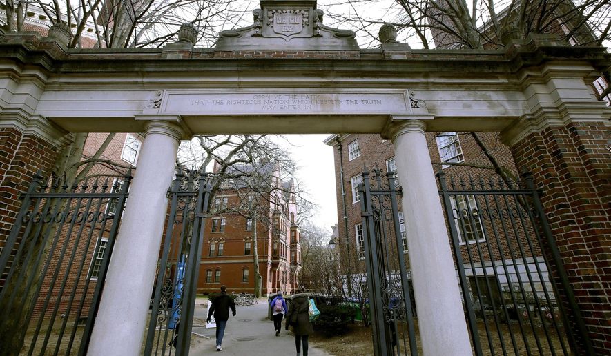 A gate opens to the Harvard University campus Dec. 13, 2018, in Cambridge, Mass. More than 30 Harvard University student organizations released a joint statement saying that the &quot;Israeli regime [is] entirely responsible&quot; for the surprise attack from Hamas that has killed hundreds of Israelis. (AP Photo/Charles Krupa, File)