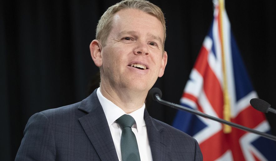 New Zealand's Prime Minister Chris Hipkins announces an end to all COVID-19 restrictions during a press conference at the Parliament in Wellington, Monday, Aug. 14, 2023. New Zealand removed the last of its remaining COVID-19 restrictions, marking the end of a government response to the pandemic that was watched closely around the world. (Mark Mitchell/NZ Herald via AP)