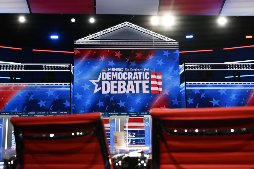 In this Nov. 19, 2019, file photo, an Atlanta stage gets prepared for a 2020 Democratic presidential primary debate. (AP Photo/Mike Stewart) ** FILE **
