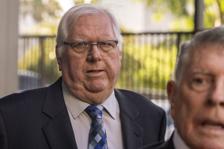 Orange County Superior Court Judge Jeffrey Ferguson, left, walks out with his attorney John Drummond Barnett, right, after a hearing at the Clara Shortridge Foltz Criminal Justice Center, Tuesday, Aug. 15, 2023 in Los Angeles. Judge Ferguson, charged with killing his wife during an argument while he was drunk, pleaded not guilty Tuesday, and his lawyer says it was an "accidental shooting." (AP Photo/Damian Dovarganes)
